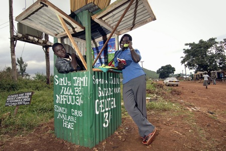 Kenya - two men at phone kiosk